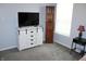 Bedroom featuring a white dresser, a flat-screen TV, and modern furniture at 12901 N Collett Way, Camby, IN 46113