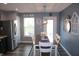 Cozy dining area with stainless steel refrigerator, and lots of natural light with great backyard views at 12901 N Collett Way, Camby, IN 46113