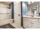 Modern bathroom featuring a vanity with white countertop, a toilet, and a bathtub shower combo at 13346 W Sherbern Dr, Carmel, IN 46032