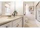 Bathroom featuring a granite countertop vanity, a toilet, and a bathtub shower combo at 13346 W Sherbern Dr, Carmel, IN 46032