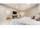 Bright bedroom featuring white walls, two study areas, neutral decor, and a ceiling fan at 13346 W Sherbern Dr, Carmel, IN 46032