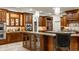 Charming kitchen with wood cabinetry, granite countertops, and ample storage space at 13346 W Sherbern Dr, Carmel, IN 46032