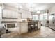 Well-equipped laundry room with modern fixtures and ample counter space at 13346 W Sherbern Dr, Carmel, IN 46032