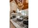 Beautiful living room showcases a fireplace, wood ceiling, and large windows at 13346 W Sherbern Dr, Carmel, IN 46032