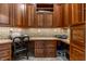 Cozy office space with custom wooden cabinets and drawers, perfect for remote work at 13346 W Sherbern Dr, Carmel, IN 46032