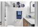 Stylish half bathroom with elegant vanity, marble countertop and decorative accents at 13844 N Cardonia Dr, Camby, IN 46113