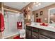 Bathroom featuring double vanity, glass shower, and coordinated towels at 13844 N Cardonia Dr, Camby, IN 46113