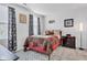 Cozy bedroom features a queen-sized bed with patterned bedding, decor, and matching curtains at 13844 N Cardonia Dr, Camby, IN 46113