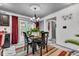 Cozy dining room with modern chandelier, table seating four, and access to a staircase at 13844 N Cardonia Dr, Camby, IN 46113