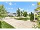 Residential street view showcasing well-maintained homes, green lawns, and mature trees on a sunny day at 13844 N Cardonia Dr, Camby, IN 46113