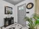 Stylish foyer with elegant marble floors, a gray front door, and tasteful decor, creating a welcoming entrance at 13844 N Cardonia Dr, Camby, IN 46113