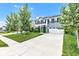 Attractive home featuring a long driveway and a lush green lawn, complemented by mature trees at 13844 N Cardonia Dr, Camby, IN 46113