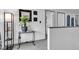 Bright hallway features neutral decor, gray trim, and artful details at 13844 N Cardonia Dr, Camby, IN 46113
