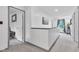 Hallway showcases gray trim, a window, and leads to the bedrooms and bathrooms at 13844 N Cardonia Dr, Camby, IN 46113