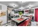 Open concept kitchen with stainless steel appliances, granite counters, and breakfast bar seating at 13844 N Cardonia Dr, Camby, IN 46113