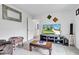Inviting living area featuring a flat screen television, leather seating, and stylish decor for comfortable entertaining at 13844 N Cardonia Dr, Camby, IN 46113