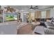Comfortable living room featuring a leather sofa, ceiling fan, and neutral decor at 13844 N Cardonia Dr, Camby, IN 46113