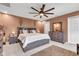 This cozy bedroom features a ceiling fan and contemporary furnishings at 13844 N Cardonia Dr, Camby, IN 46113