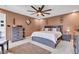 This stylish bedroom features contemporary decor, ceiling fan, and bedside tables at 13844 N Cardonia Dr, Camby, IN 46113
