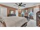 Bedroom displays a large bed, contemporary decor, natural lighting, and seating area at 13844 N Cardonia Dr, Camby, IN 46113
