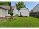 Lush backyard featuring a shed with green grass, providing a serene outdoor space at 1411 Mimosa Ct, Greenfield, IN 46140