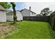 Spacious backyard with a shed and a wooden fence, perfect for outdoor activities and privacy at 1411 Mimosa Ct, Greenfield, IN 46140