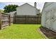 Well-maintained backyard featuring a shed and wooden fence, offering both storage and privacy at 1411 Mimosa Ct, Greenfield, IN 46140