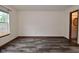 Bedroom features wood-look flooring and doorway view to bathroom at 1411 Mimosa Ct, Greenfield, IN 46140