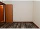 Bedroom features wood-look flooring and a closet with modern wood door at 1411 Mimosa Ct, Greenfield, IN 46140