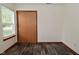 Bedroom features wood-look flooring and a closet, with natural light from the window at 1411 Mimosa Ct, Greenfield, IN 46140