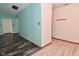 Open entryway with light-blue accent walls and wood-look floors at 1411 Mimosa Ct, Greenfield, IN 46140