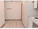 Bright kitchen features a white refrigerator and updated floors at 1411 Mimosa Ct, Greenfield, IN 46140