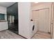 Open laundry area with washer and dryer near bi-fold closet at 1411 Mimosa Ct, Greenfield, IN 46140