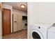 View of the laundry area and a kitchen area with modern appliances at 1411 Mimosa Ct, Greenfield, IN 46140