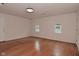 Bright living room featuring wood floors, neutral paint, and large windows at 1411 Mimosa Ct, Greenfield, IN 46140