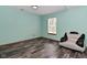 Inviting living room with wood-look floors and a bright window, providing natural light at 1411 Mimosa Ct, Greenfield, IN 46140