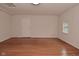 Bright living room featuring wood floors, neutral paint, and large windows at 1411 Mimosa Ct, Greenfield, IN 46140