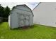 Well-maintained shed with double doors for easy storage in the backyard at 1411 Mimosa Ct, Greenfield, IN 46140
