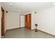 Finished basement with built-in shelving, door, and neutral walls at 14446 Chapelwood Ln, Fishers, IN 46037
