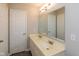 Bathroom featuring a double sink vanity with ample countertop space and a large mirror with Hollywood lights at 14446 Chapelwood Ln, Fishers, IN 46037