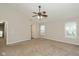 Spacious carpeted bedroom with vaulted ceiling, fan, and neutral walls at 14446 Chapelwood Ln, Fishers, IN 46037