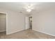 Bedroom offering closet space, neutral paint, carpet flooring, and a ceiling fan, with an ensuite bathroom at 14446 Chapelwood Ln, Fishers, IN 46037