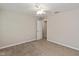 Cozy carpeted bedroom with door, ceiling fan and neutral walls at 14446 Chapelwood Ln, Fishers, IN 46037