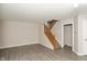 Bright, airy living room featuring neutral paint, hard surface floors, and a stairway to the second floor at 14446 Chapelwood Ln, Fishers, IN 46037