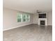 Bright, airy living room featuring neutral paint, hard surface floors, a window, and fireplace at 14446 Chapelwood Ln, Fishers, IN 46037