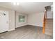 Bright, airy living room featuring neutral paint, hard surface floors, a window and front door at 14446 Chapelwood Ln, Fishers, IN 46037