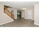 Bright, airy living room featuring neutral paint, hard surface floors, and a stairway to the second floor at 14446 Chapelwood Ln, Fishers, IN 46037