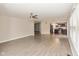 Bright, airy living room with hard surface floors leading into the kitchen and dining area at 14446 Chapelwood Ln, Fishers, IN 46037