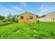 Cozy home backyard, featuring a well-maintained lawn and charming exterior at 1513 S Rural St, Indianapolis, IN 46203