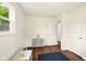 A bright bedroom with hardwood floors, a gray dresser and room to play at 1513 S Rural St, Indianapolis, IN 46203